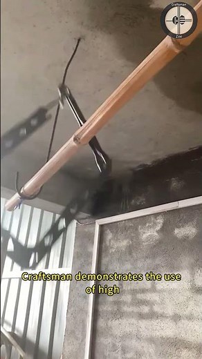 Craftsman demonstrates the use of high-altitude rope threading tools