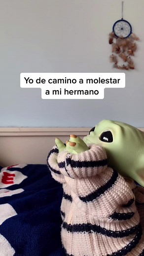 Playful Alien Puppet Entertains and Teases Sibling