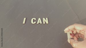 Yes I can motivation - Man hand separating letter T from can’t to say I can. Determination Success Challenge believe Motivation aspirations to achieve results Aim goal Business concept.