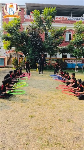 Takshsheela International school on Instagram: "✅ Benefits of the Hoop Jumping Game- 1. Improves balance – Jumping inside hoops helps kids stay steady. 2. Strengthens leg muscles – Continuous jumping builds lower-body strength. 3. Enhances coordination – Kids learn to time their jumps correctly. 4. Boosts focus – They must look, aim, and jump accurately into each hoop. 5. Increases agility – Quick movements improve flexibility and speed. 6. Develops gross motor skills – Big body movements get st
