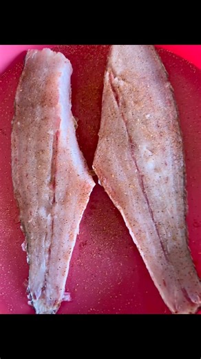 Redfish on the half shell going on the pit