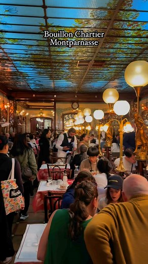 117K views · 1.3K reactions | Dinner at Bouillon Chartier Montparnasse feels like a step back in time. Built in the Belle Époque era, the restaurant keeps its old Paris charm — tall mirrors, glowing lights, and buzzing energy.The food is classic, simple, and comforting — just like it was over a century ago.A true taste of history on a plate! #paris | Paris in Pictures | Facebook