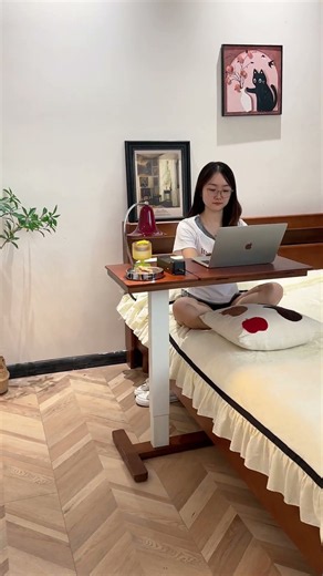 This solid wood bedside laptop table is literally my favorite