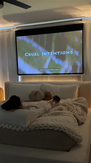 Darth Daddy on Instagram: "I don’t push products very often but I’m telling yall that a projector is a vibbbbee. I use it more than any tv in my house! Just something about it that feels so fun and iconic😌 It’s been awhile since I watched Cruel Intentions. Such a good 90s movie. I swear the 90s pumped out the best movies and music 👉🏻👈🏻 What’s yall fav 90s movie? #movienight #projector #bedroomprojector"