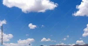 Beautiful white clouds in a blue sky background. Cotton clouds in blue sky. Natural view of clouds. Meteorology and environment concept background. Cumulus clouds background. Drone high view.