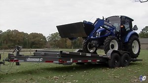 #DoWork with our new Low Profile Tilt, model 48HDT-LP. 8" I-Beam frame, full 82" wide tilt deck, and room for all of your gear in the V-nose tongue box with HD lid that doubles as bonus deck space. Available in split deck and full bed tilt. #diamondc #seethedifference #tilttrailer #toolbox #skidsteer #tractor #construction | Diamond C Trailers