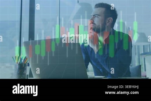 Vertical video: Reacting to stock chart overlay, man in navy shirt typing on laptop at desk trading. Office, urban, finance, analytics, professional, focused, keyboard Stock Video Footage - Alamy