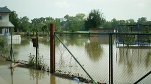Flooded house river flood sandbag protection after water consequences damaged