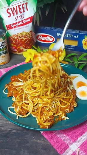 Low and Slow Cooked Filipino-Style Spaghetti Filipino-style spaghetti is a unique variation of the traditional Italian dish, known for its sweet and savory flavor profile. It's a beloved comfort food in the Philippines, often served at birthdays, family gatherings, and celebrations. The recipe typically uses a combination of ground meat, hotdogs, banana ketchup, and sugar, which gives it its characteristic sweetness. For today, we will be making an extra-special version, with a few special ingre