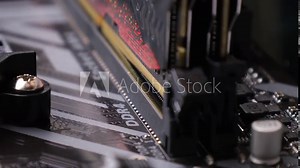 A random-access memory (RAM) installs in the socket on motherboard. PC hardware