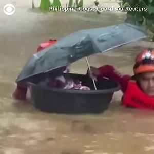 Residents were ferried to safety Thursday as Typhoon Rai lashed the Philippines, causing severe flooding. Video shows an infant among those evacuated amid chest-high floodwaters. | CBS News