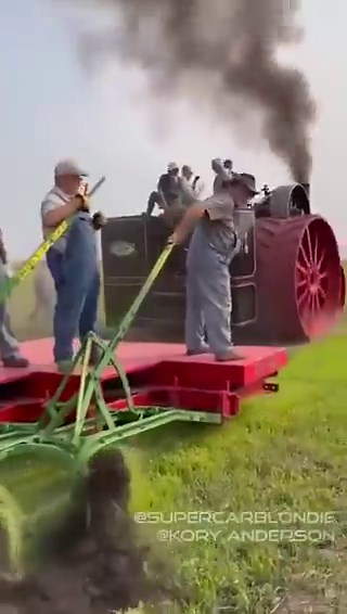 a restored 1905 Case 150 steam tractor, the largest ever built by Case, pulling 44 John Deere plows