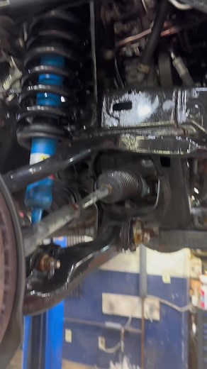 Car Suspension Repair: Mechanic Inspects Undercarriage