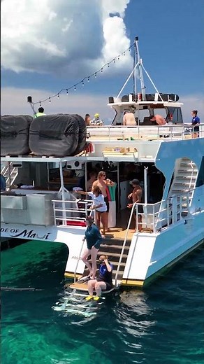 Dive into the crystal-clear waters of Turtle Town with Pride of Maui!