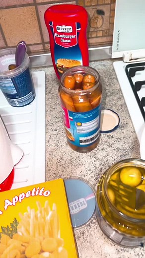 Delicious Hot Dog Preparation with Gourmet Condiments