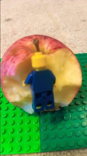 Lego guy eating human food
