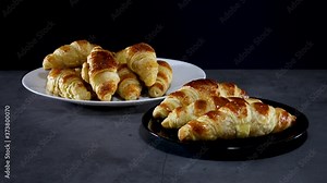 Tasty croissants served on plate on the table