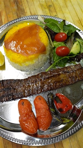 #Kebab Barg – a tender and authentic Persian classic. Young and #tender beef fillets marinated in a refined blend of Persian spices, then grilled to perfection. Served with fragrant saffron rice and fresh vegetables, offering a balanced and truly authentic dining experience. 🍽️ Each plate is a tribute to the finesse and heritage of Iranian cuisine. 📍 Montreal – #Restaurant Nab FR Kebab Barg – un #classique_iranien, tendre et authentique. Des filets de bœuf jeunes et #tendres, marinés dans un m