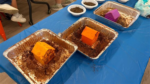 Kids get messy learning flood solutions in Austin