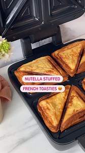 Nutella stuffed French toasties 🤤 Say less! 👩‍🍳 Sunbeam Appliance 👩‍🍳 TurboCrunch 4 Slice Toastie Maker 🍫 Ingredients 🍫 2 eggs 1/2 cup milk 1 tsp cinnamon 1 tsp vanilla essence Dusting of cinnamon sugar Fresh berries to serve #Sunbeam #LiveMoreEffortless #TurboCrunchSliceToastieMaker | Sunbeam Australia and New Zealand