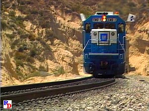 A set of three new EMD SD60 demonstrator locomotives is filmed with a hot intermodal train as it traverses Cajon Pass. From the Pentrex show "Best of 1985 Railroading" https://rfd.video/Best1985 | Railfan Depot