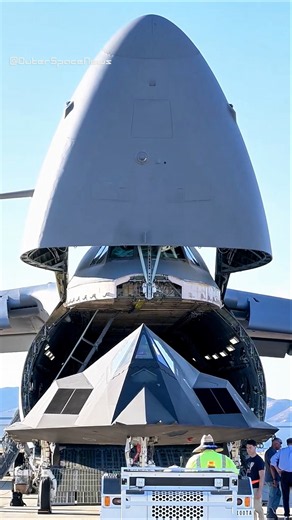 Crews Load an F-117 Nighthawk Into a C-5M