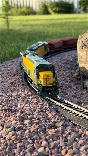 HO Scale Train in a Backyard