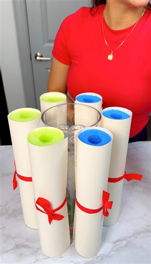 Easy Grad party decoration 🎓 With just a few cool noodles, white paper and red ribbon I made a very cool and easy decoration your graduate will love. | Cirqnamics