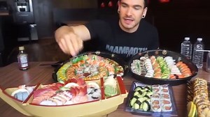 220K views · 6.2K reactions | This giant Sushi challenge was made to destroy people! Featuring premium maki, nigiri and sashimi, this is a big sushi meal! Dragon rolls, spicy salmon, tuna, clam, avocado and many other fish and types of sushi comprise this challenge! Can we defeat this massive sushi challenge, or will it swallow us whole? Tune in to find out! | Joel Hansen - Model Vs Food | Facebook