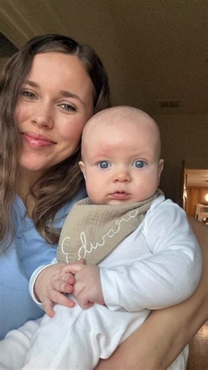 Jessa Seewald on Instagram: "Drooly little cuddle bug. 🥰 This hand-embroidered bib from @stitch.139 is my fav. 💙"