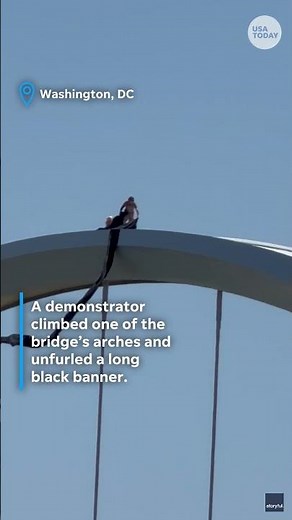Protester scales Frederick Douglass Memorial Bridge in Washington DC