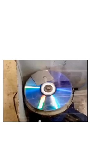 Amazify X on Instagram: "When you spin a CD at very high speed, it stops behaving like a solid object and starts revealing the limits of its design. A compact disc is made from thin polycarbonate plastic, engineered to rotate safely at normal player speeds. But as rotation increases, centrifugal force pulls outward on every part of the disc, stretching it microscopically. At extreme speeds, tiny imperfections in the CD become dangerous stress points. The outer edge experiences far more force tha