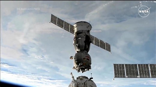 Soyuz space capsule bringing 3 Space Station crew members back to Earth