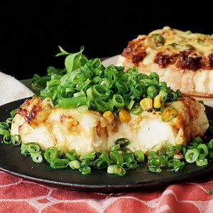 452K views · 1.9K reactions | Elevate thick, soft tofu with lots of cheese, a honeyed miso corn topping and spicy ginger pork. | Tastemade | Facebook