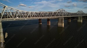 Raise drone view of cars on Brent Spence Bridge in Covington, Kentucky with cloiudy sky