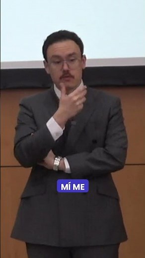 How should you position your hands when listening in a conversation?