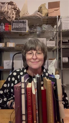 Julie’s 2026 Journaling Ecosystem! She has a lot of books going on! Here’s the line up: -Hobonichi Weeks in a Tragen cover. She is using this as her wallet, recording the weather, and writing down what she’s grateful for. -A Hobonichi Cover with a Midori Frame Notebook inside. In this notebook Julie is taking notes from all of her workshops. -Hobonichi Five Year Journal with the gorgeous red leather cover. This is Julies second 5 year journal, wow! Goals! She takes a photo of herself everyear on