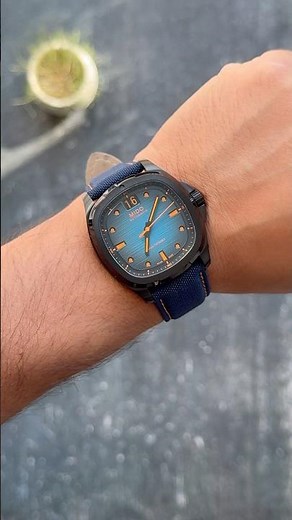 Retro-Futuristic Glow: Mido Multifort TV Big Date | The Black PVD & Electric Blue Statement
