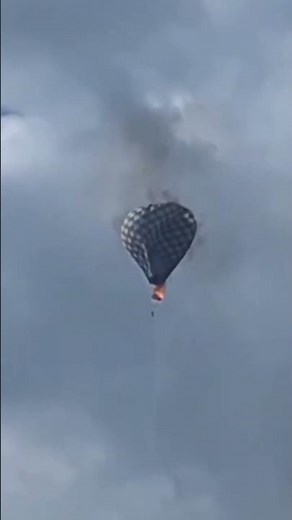 Harrowing video shows man dangling from hot air balloon #shorts