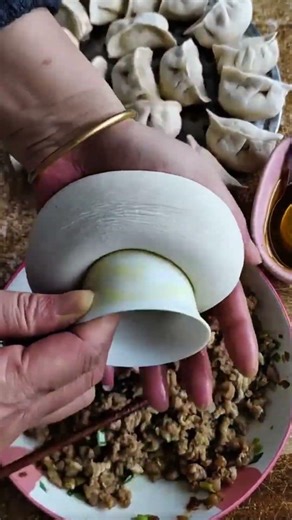 Add the beef and mix it into the dough, fold it, then shape it diagonally and straighten it out