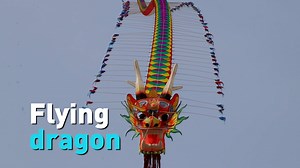 40K views · 78 reactions | With a little help from his friends, one kite maker in Mianyang, China was able to get his massive hand-made dragon kite to fly in the sky this week. What a sight to see! | CGTN America | Facebook