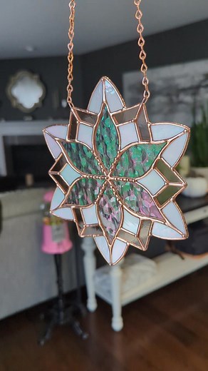 I always get the question "can you leave it copper?" Well, you have to solder the piece first with silver colored solder, but then you can apply a copper patina. A lot of glass artists don't like to mess with copper patina cause it can be a little unpredictable in how it'll apply, and in how it'll age. This bright copper penny finish will start turning to a more natural orange-copper pretty quickly, but man is it pretty! #stainedglass #copper #snowflakes #winter | Samantha Ashley Glass