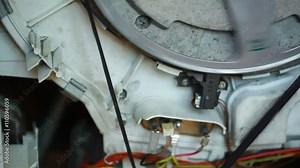 washing machine repair. rotation of the reel engine strap