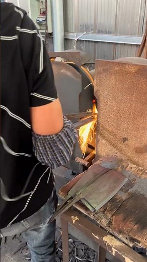 Modern blacksmith shop makes kitchen knife with rough blade. Shengbang