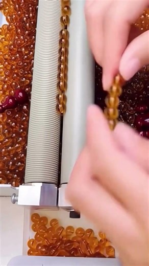 The Efficient Process Of Stringing Amber Beads Using Specialized Machinery