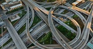 Highways and freeways in the interchange of Chicago, Illinois, United States. Los of cars move by the roads of metropolis. Top view.