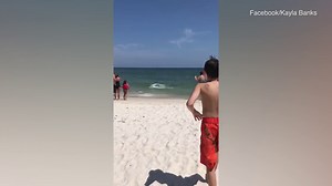 Sharks spotted in the shallow waters of Alabama's Gulf Shores