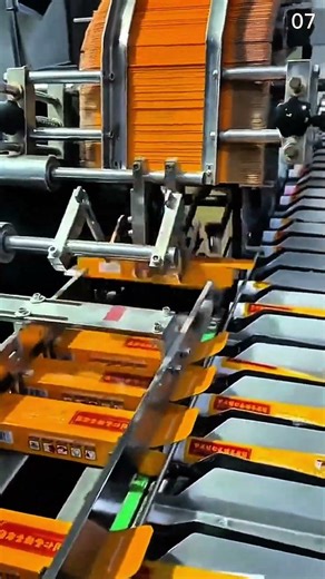 Packaging orange rectangular products automatically with industrial machine