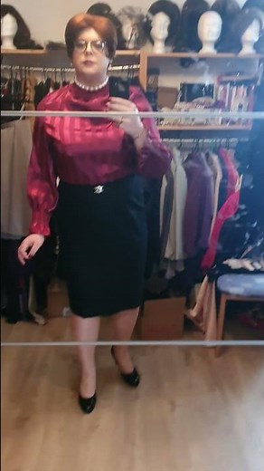 elegant crossdresser in satin blouse and pencil skirt