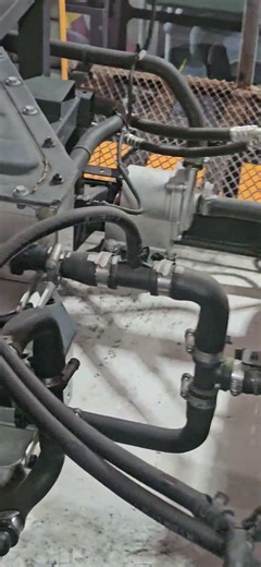 ElectriCity. Roof front contents: Air conditioner condenser, EWP 3-way valve, battery, coolant ex...